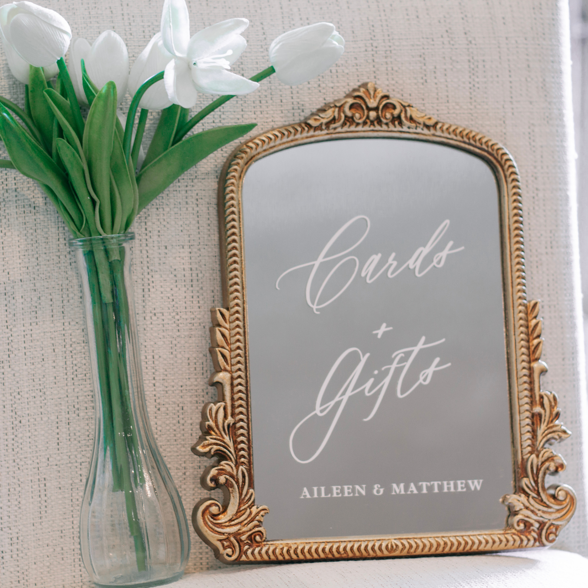 Mirror wedding sign for gifts and cards table with elegant script in ornate frame.