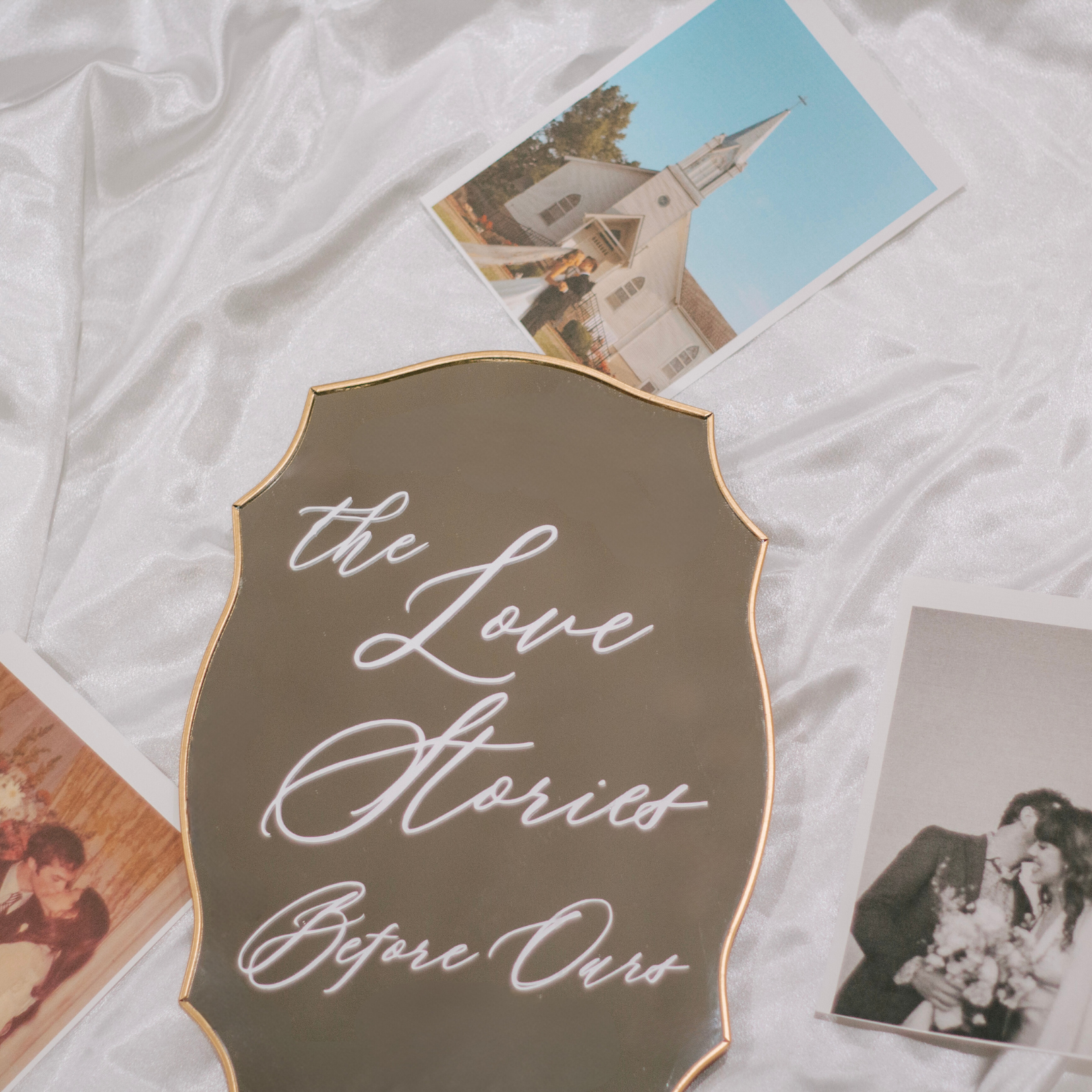 Wedding Memory Sign with vintage photos on satin tablecloth.
