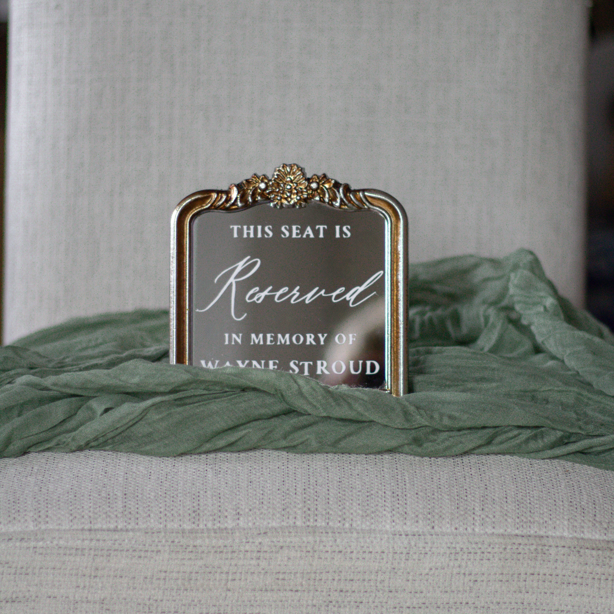 In loving memory wedding sign reserved seat with custom name on chair.