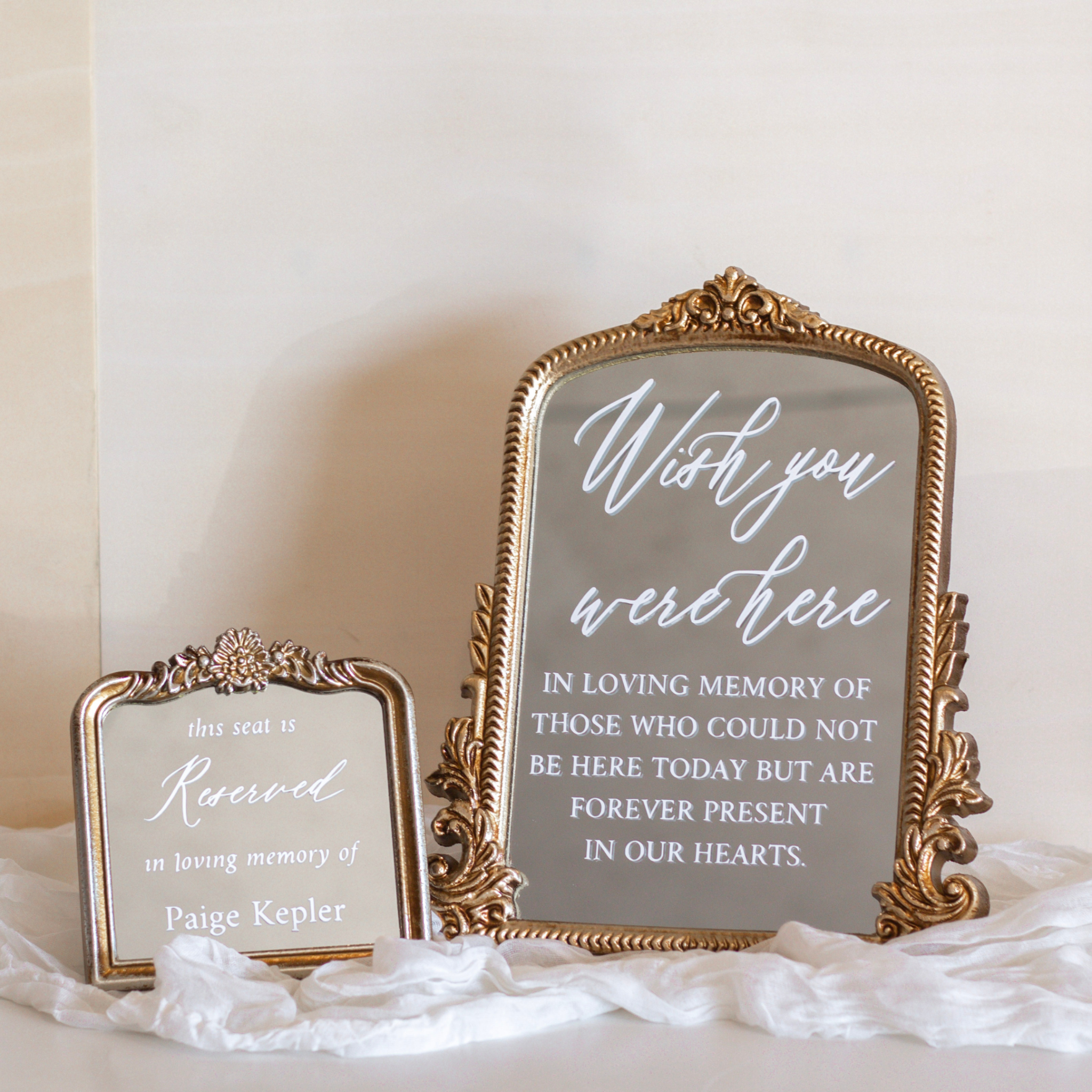 Elegant wedding memorial sign with a sentimental tribute on ornate mirrors.