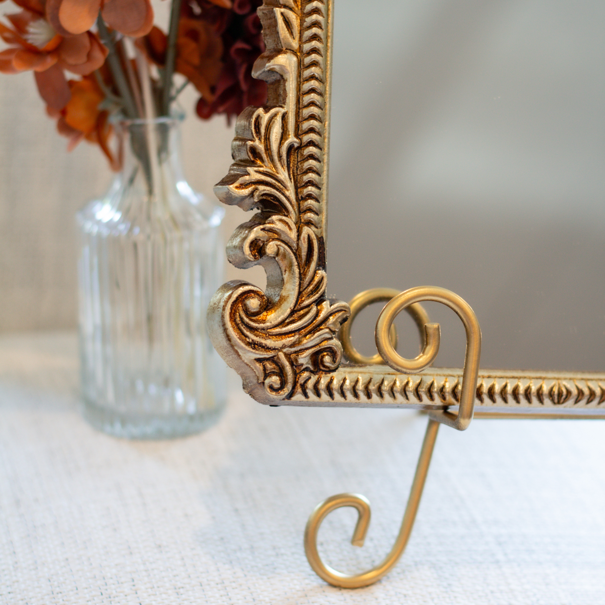 Decorative mirror wedding sign with ornate gold frame for gifts and cards table.