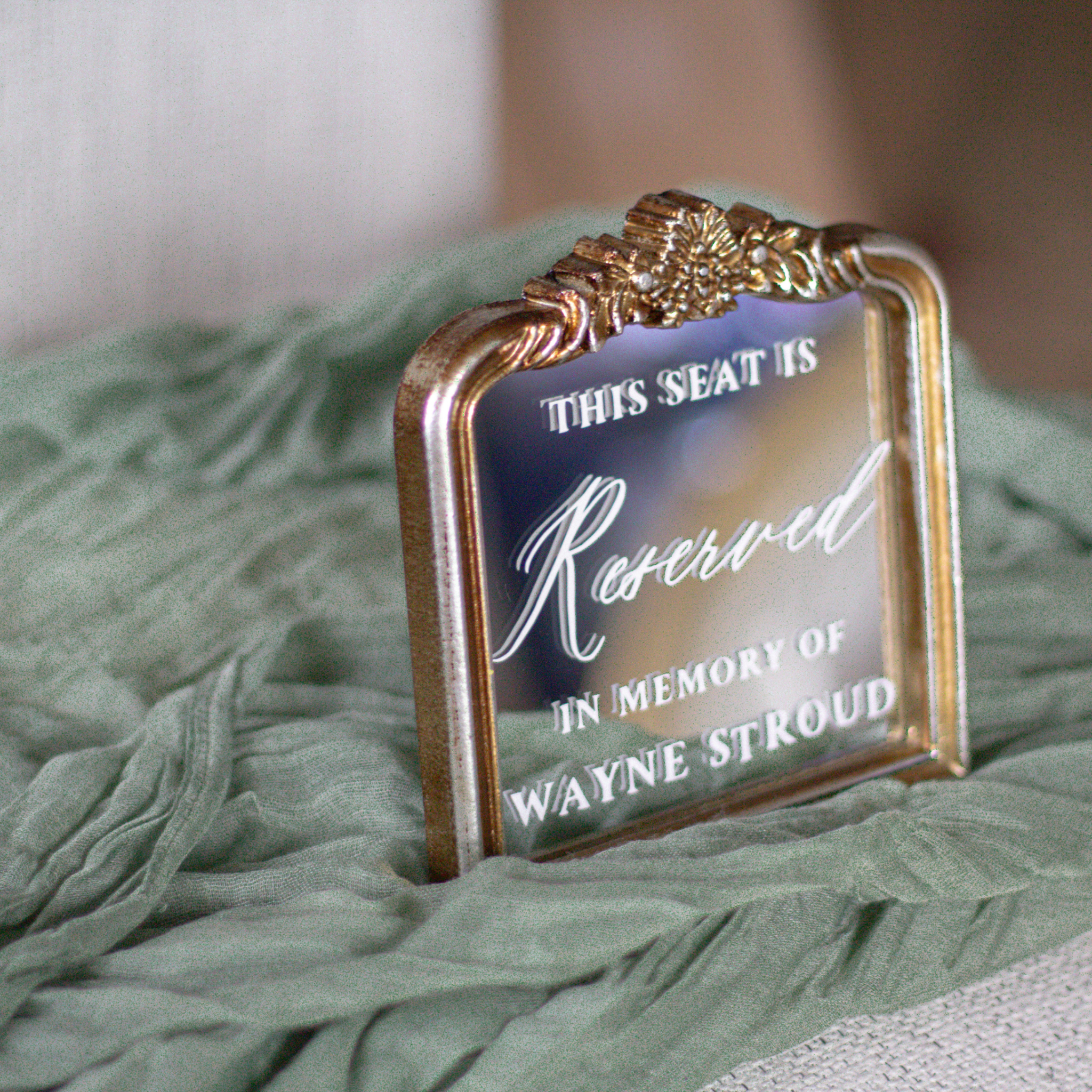 In loving memory wedding sign with "This Seat Is Reserved" and personalized name display.