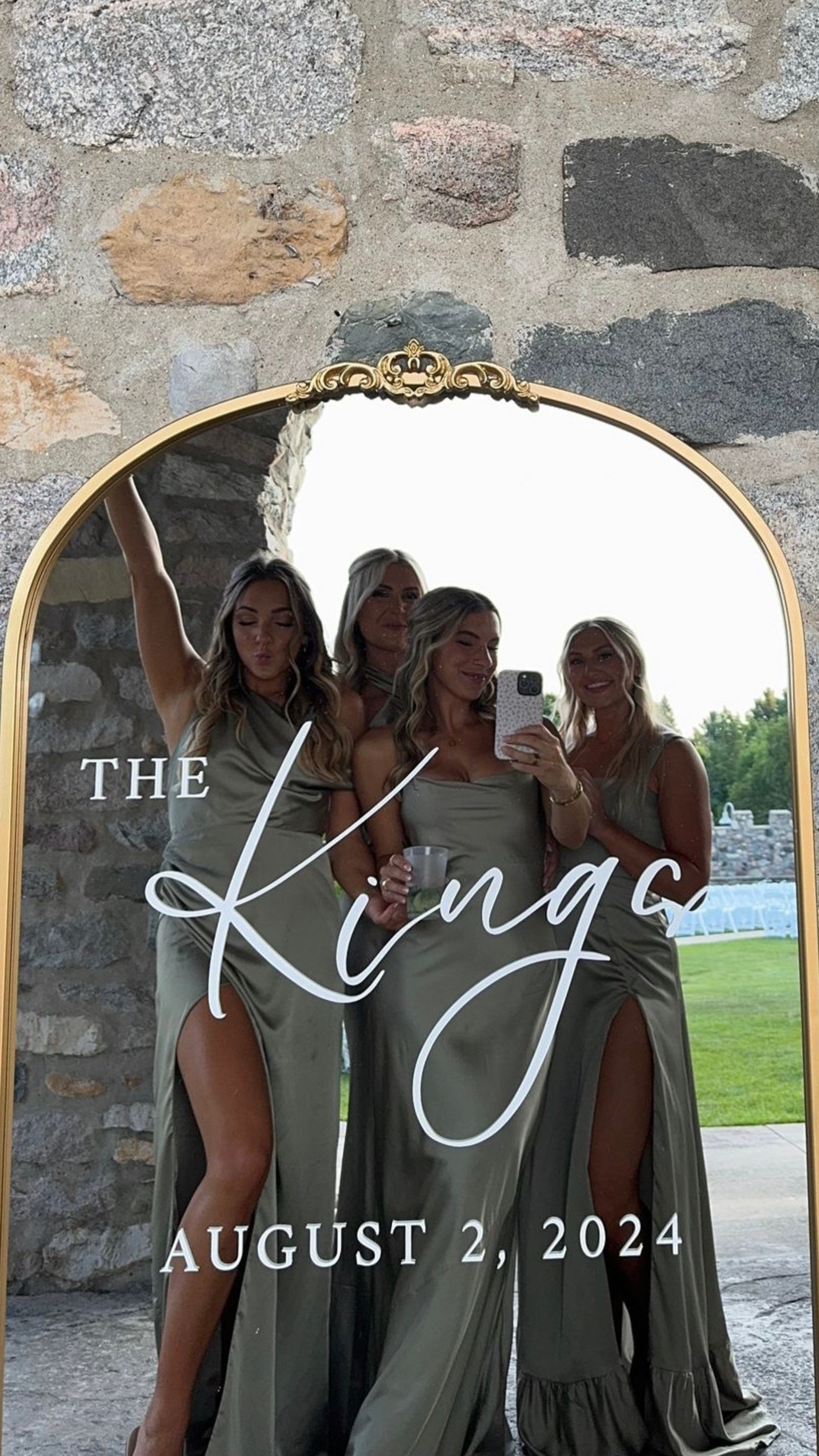 Large gold wedding welcome sign mirror with elegant script text and group reflection.