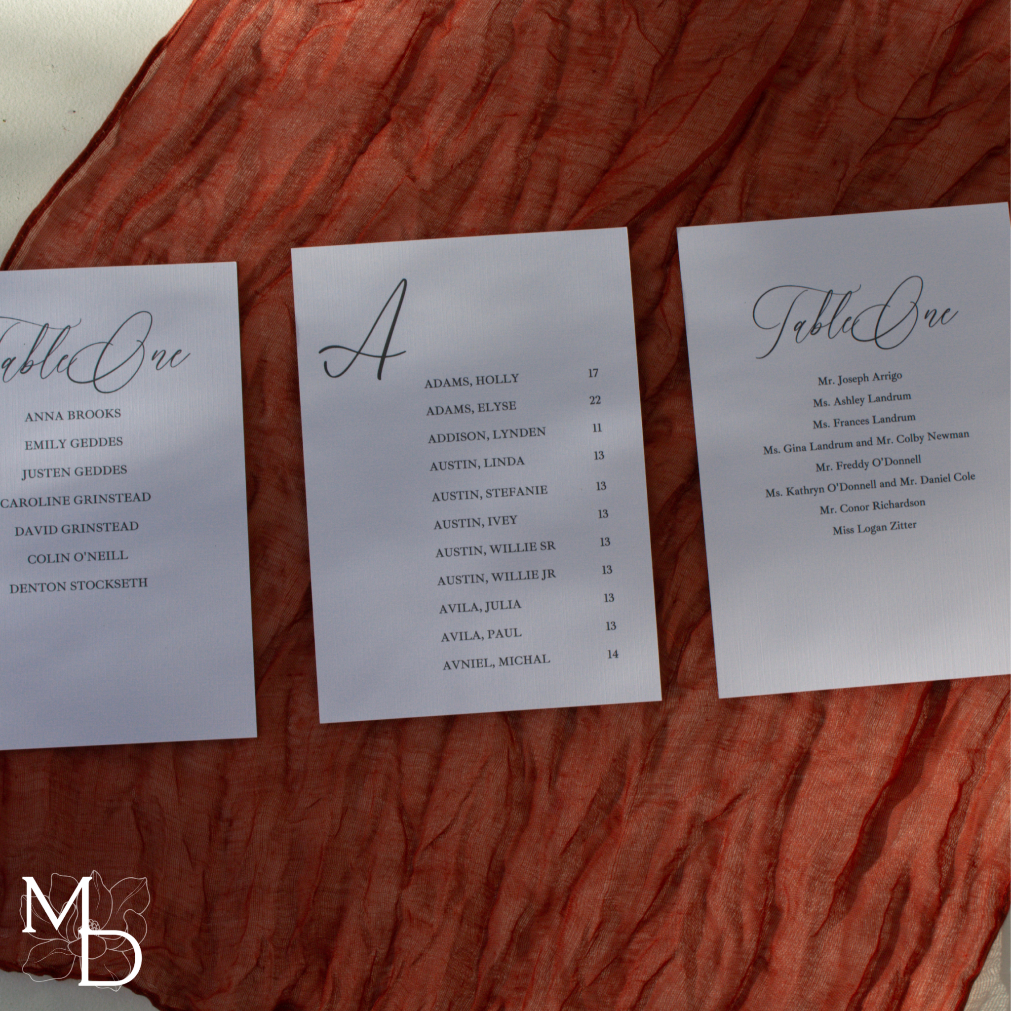 Custom wedding seating chart assignment cards on decorative linen cardstock with wax seals.