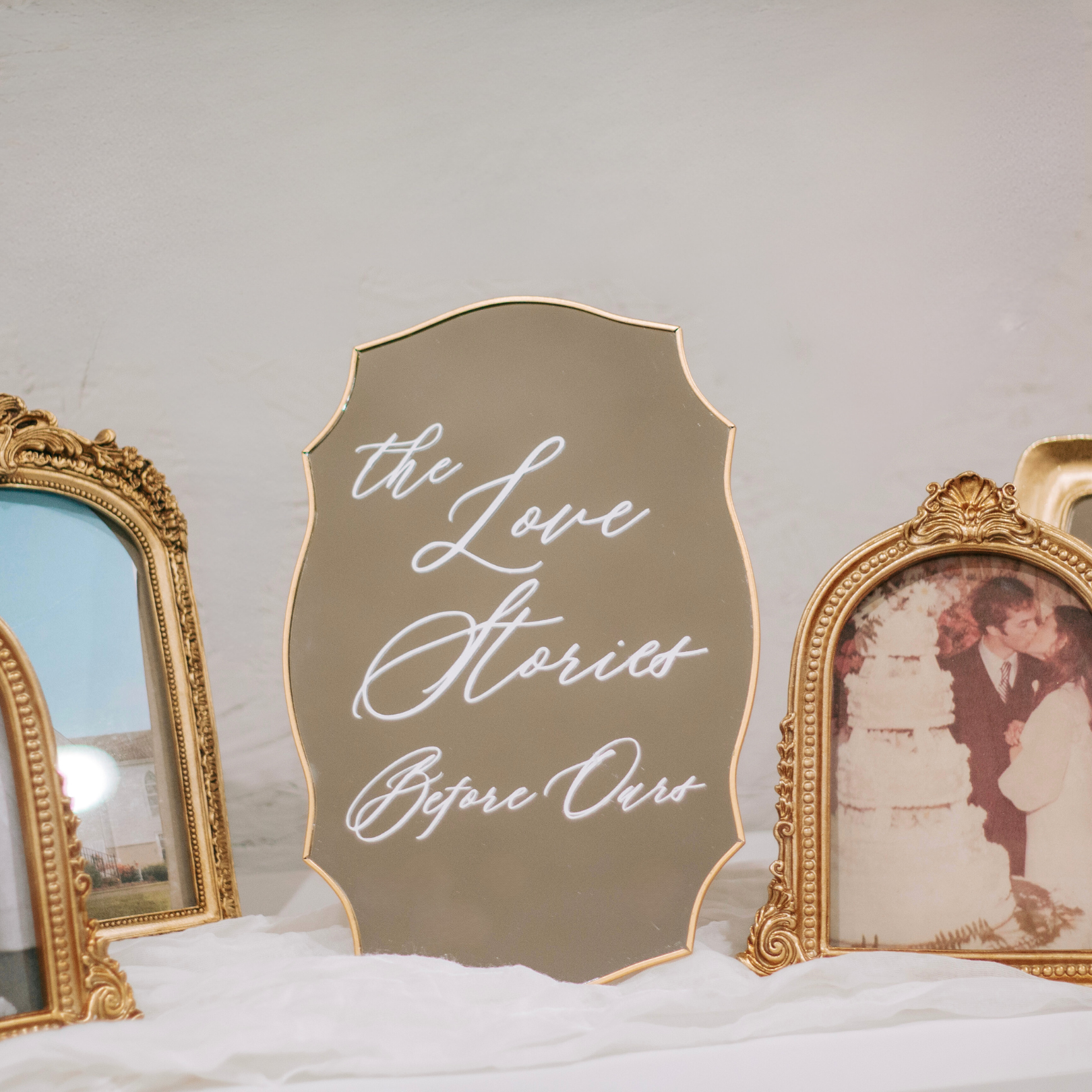 Wedding Memory Sign - "The Love Stories Before Ours" displayed with framed family photos.