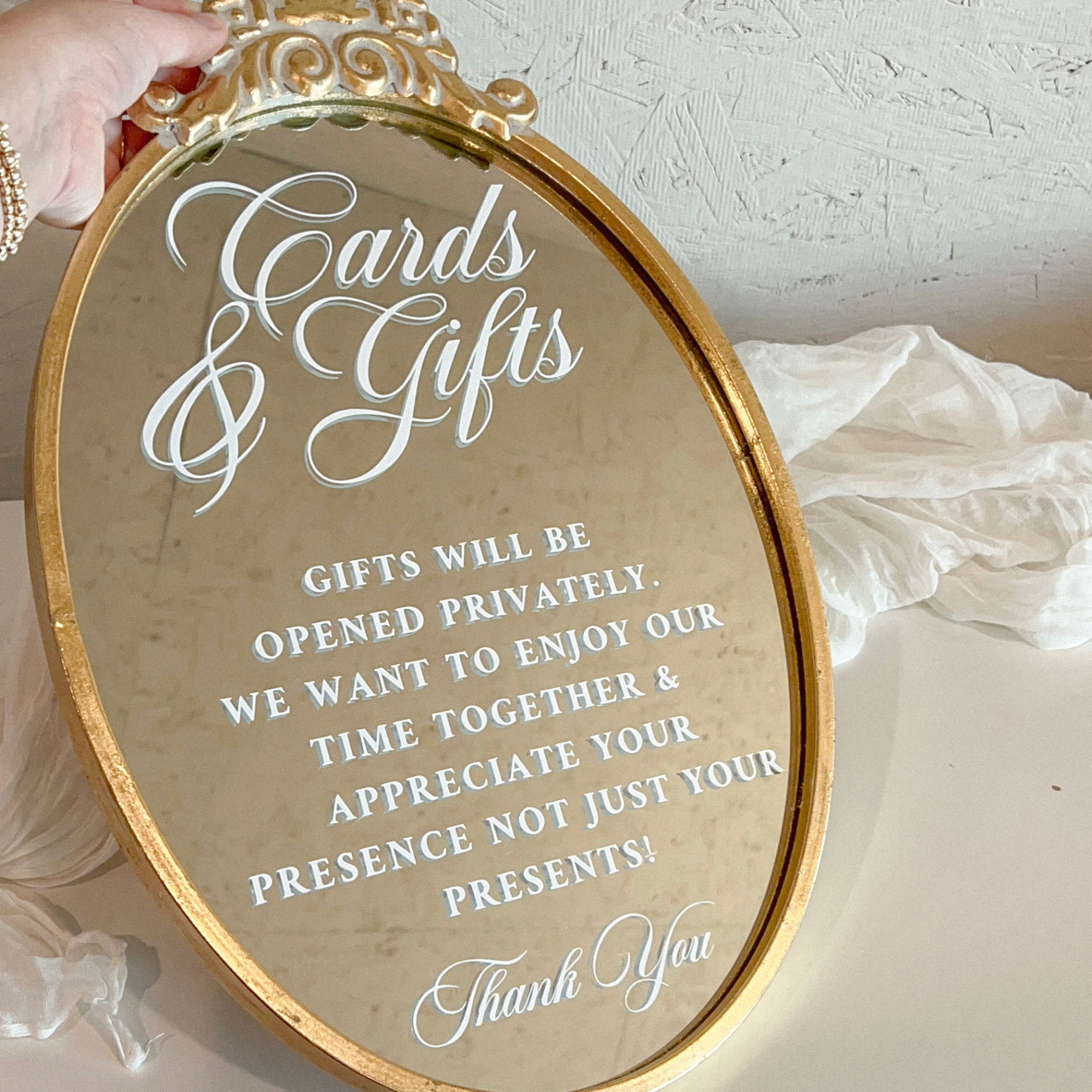 Oval mirror wedding sign for cards and gifts table with ornate gold fleuron detailing.