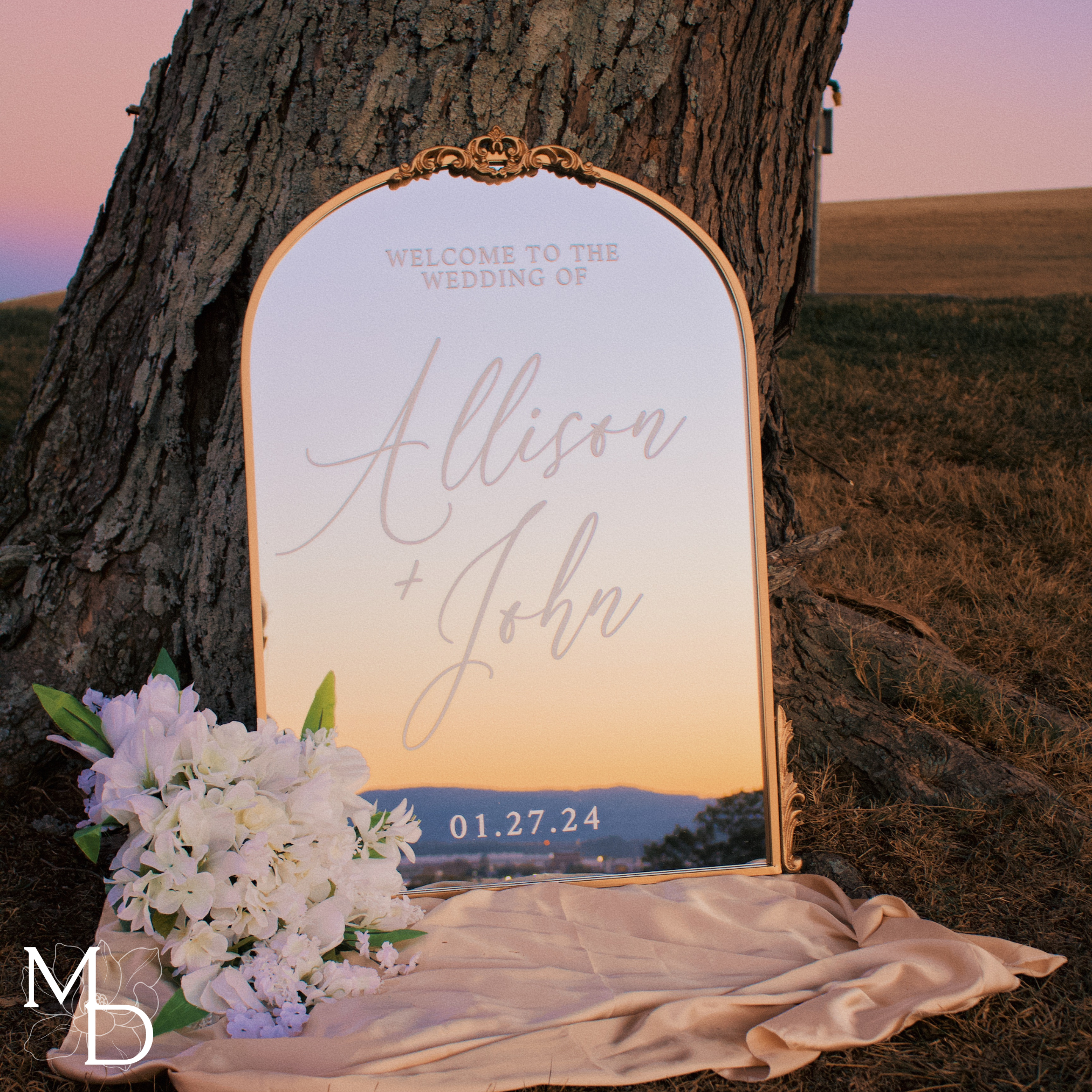 Antiqued gold arch mirror wedding sign with custom scripted calligraphy.