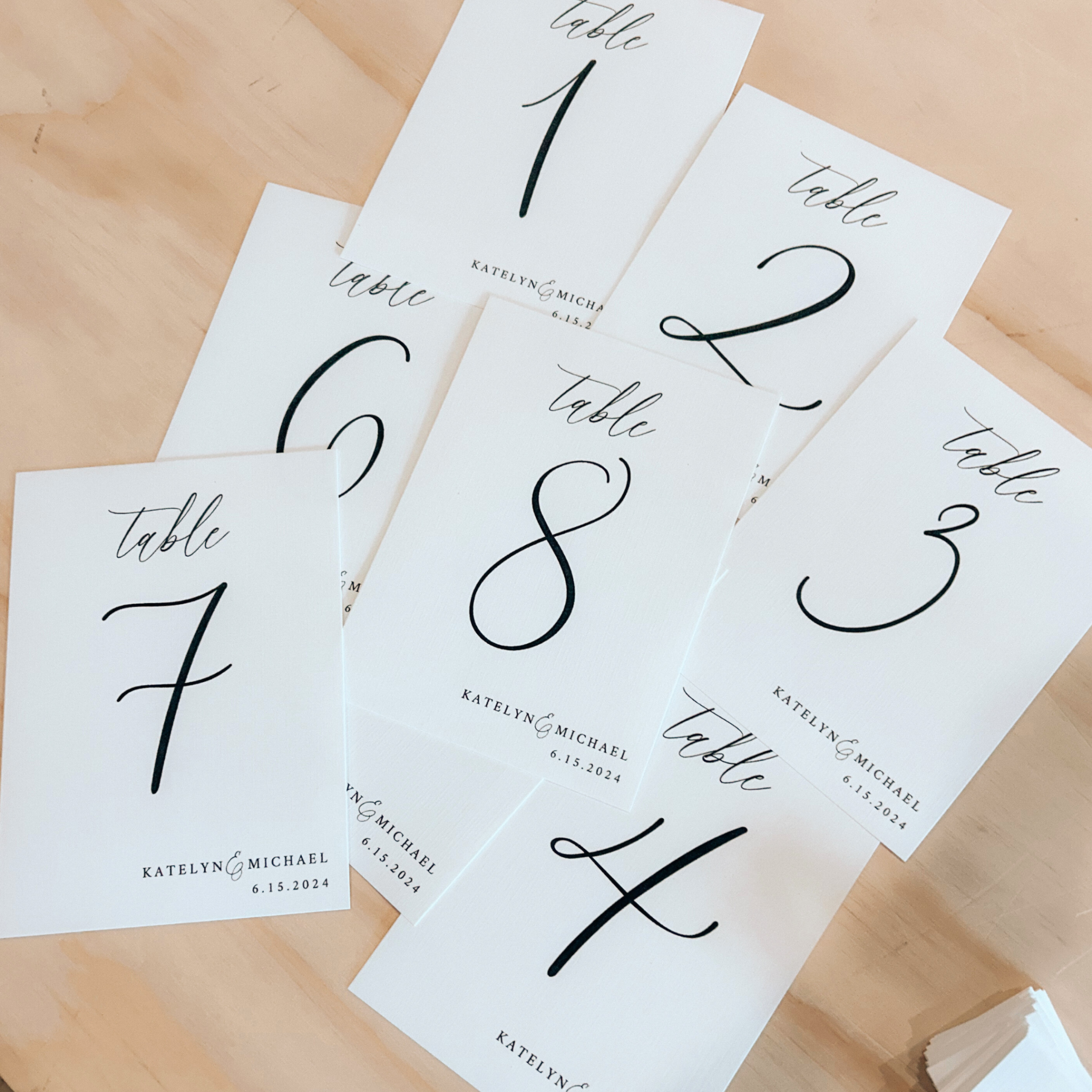 Linen Cardstock Table Numbers for weddings with elegant font design.