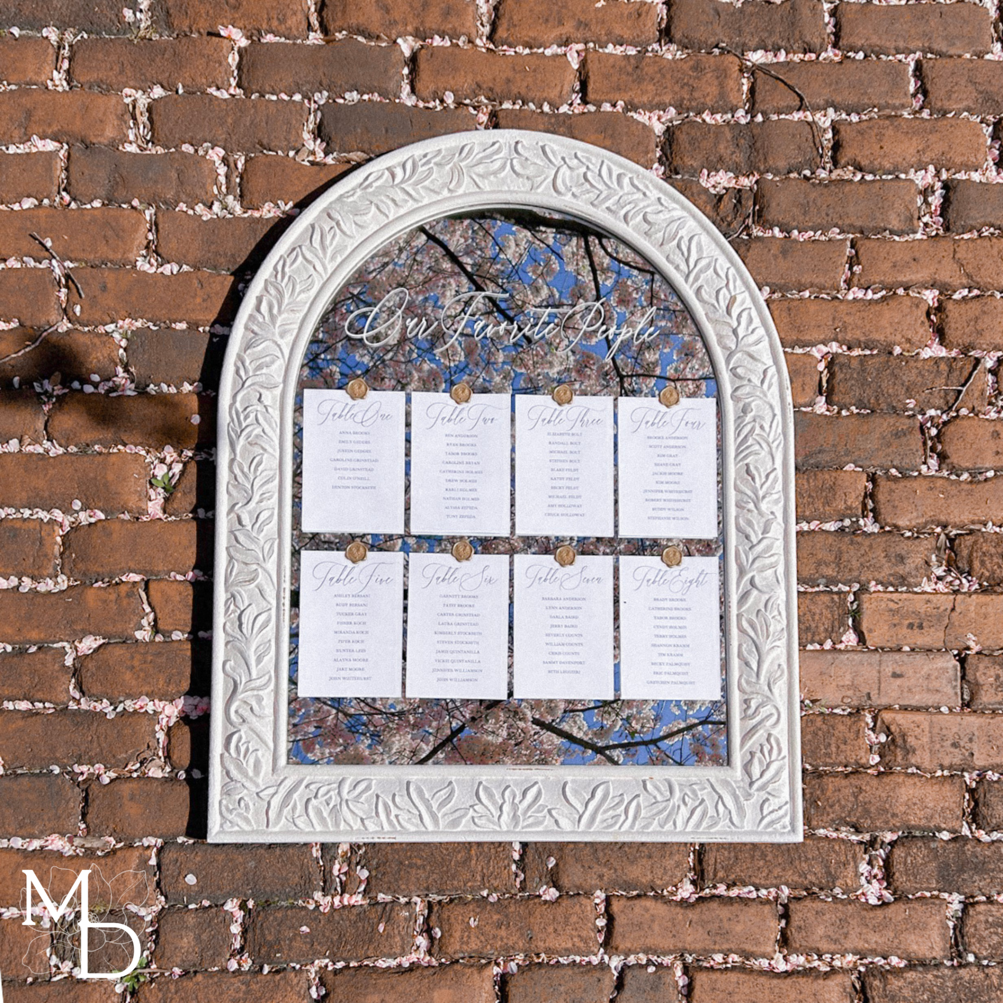 Boho large white mirror wedding guest seating chart with elegant linen cardstock and gold wax seals.