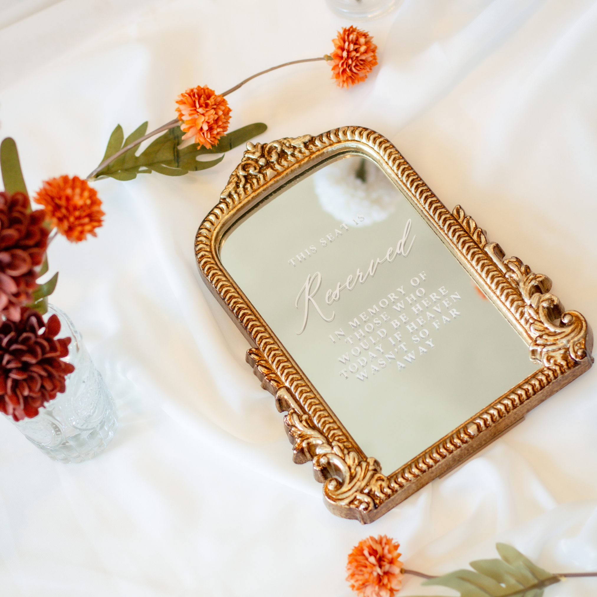 Loving Memory Wedding Sign with engraved messages on a decorated mirror and floral accents.