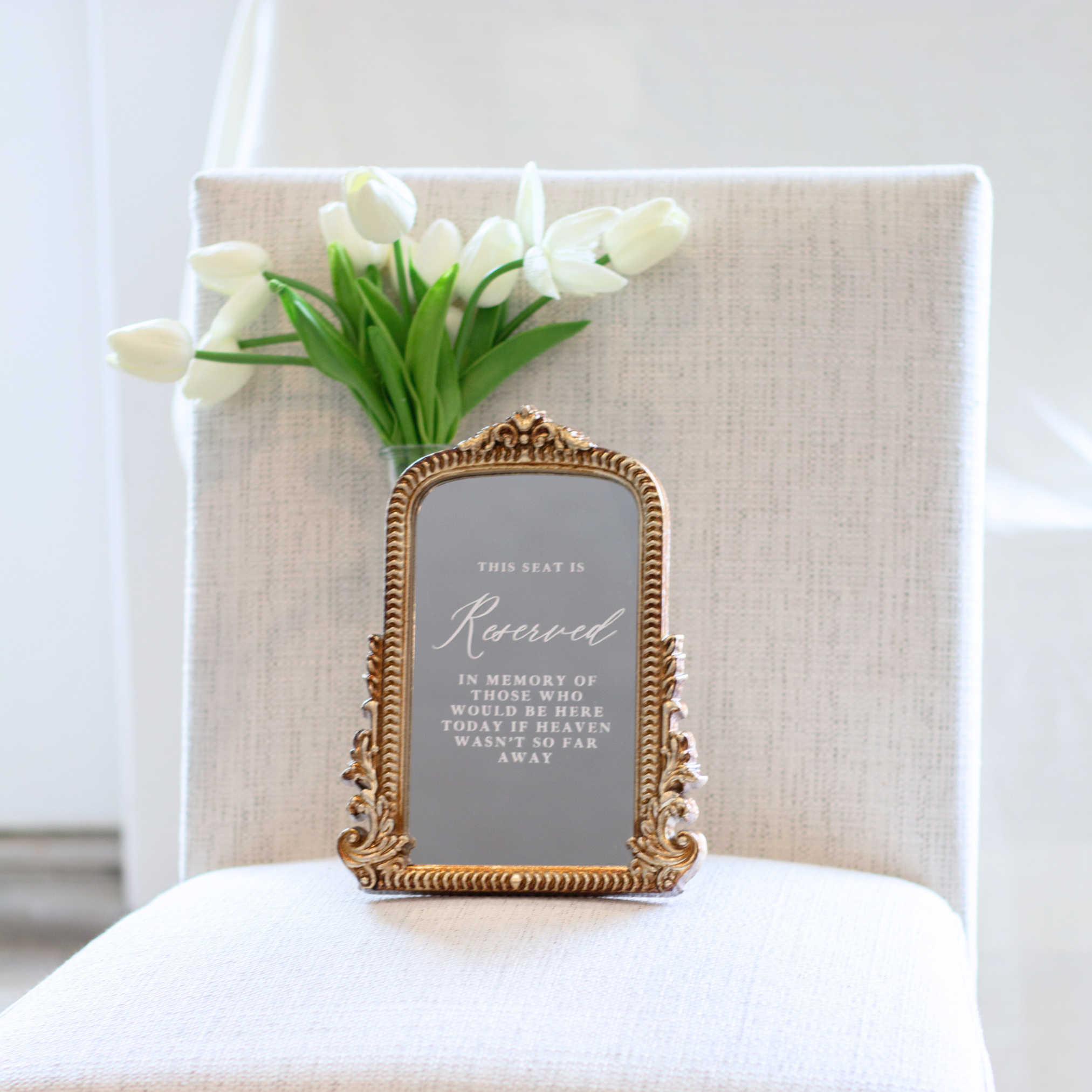 Loving Memory Wedding Sign with ornate frame on chair with tulips