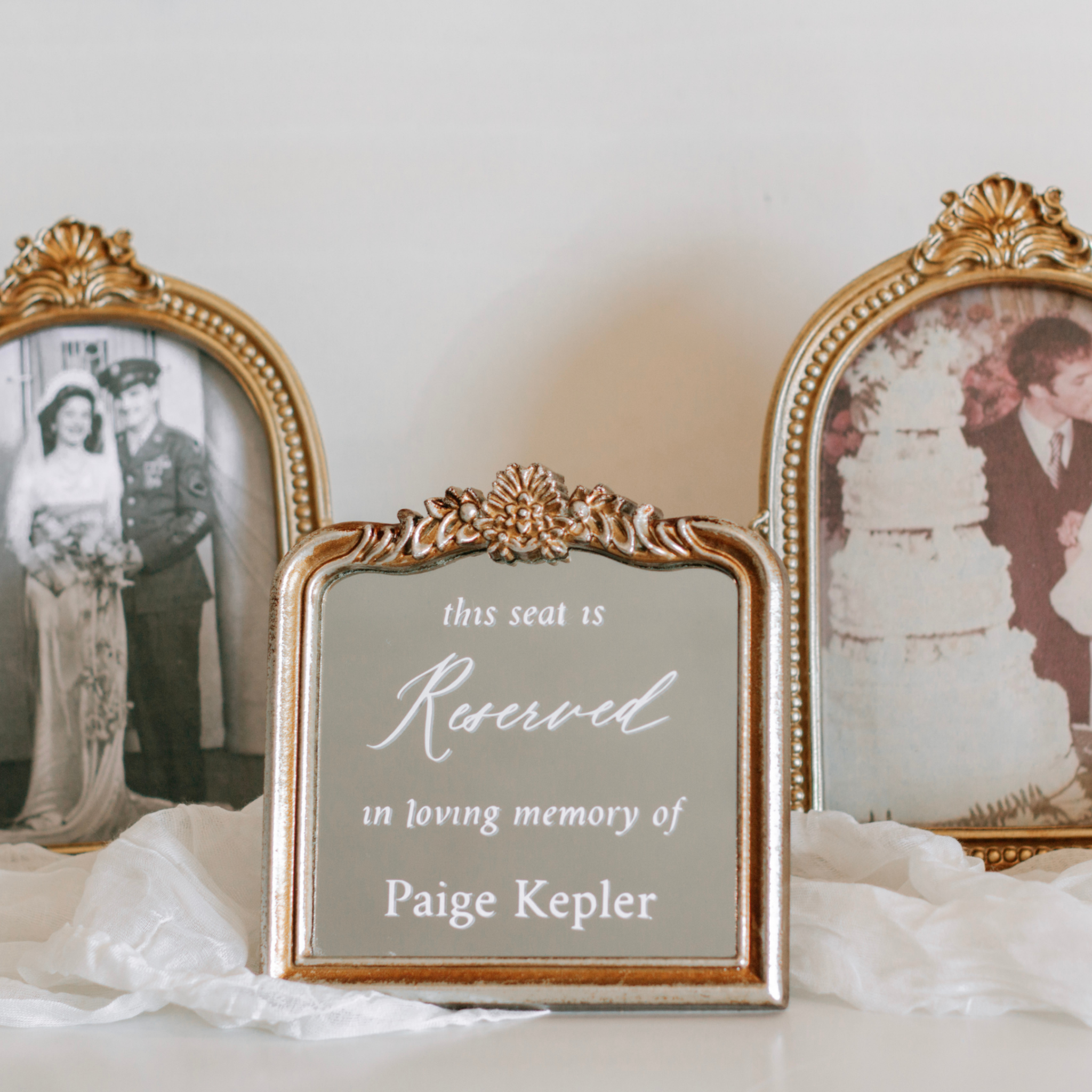 Wedding memorial sign with personalized message, displayed on a memory table with vintage photos.